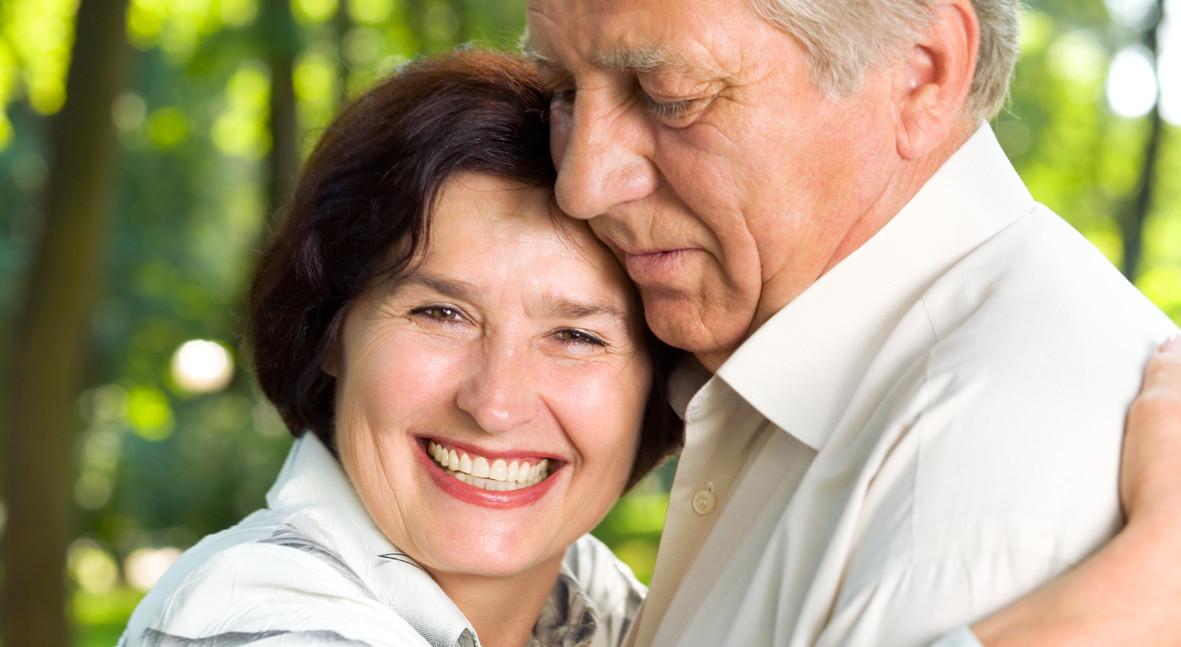 Senior happy smiling couple walking together outdoors